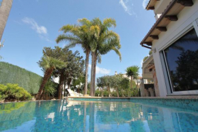 Tropical garden, villa with pool near the beach